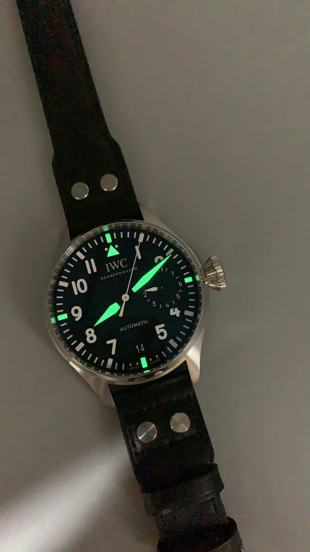 Flat sapphire over the dial, keeping the oversized numerals undistorted