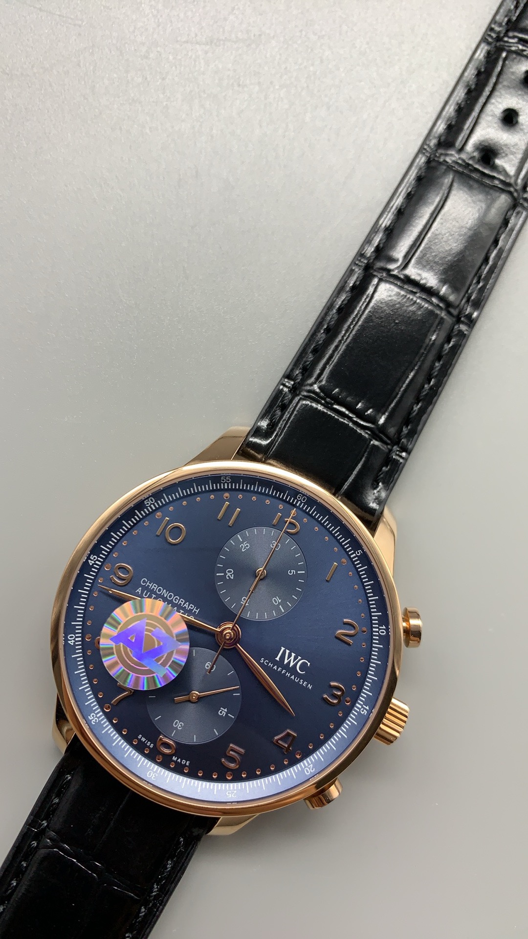 Dark blue alligator leather with a folding clasp on this 41mm chronograph