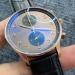 Silver-toned subdials cut through the deep blue of this chronograph dial
