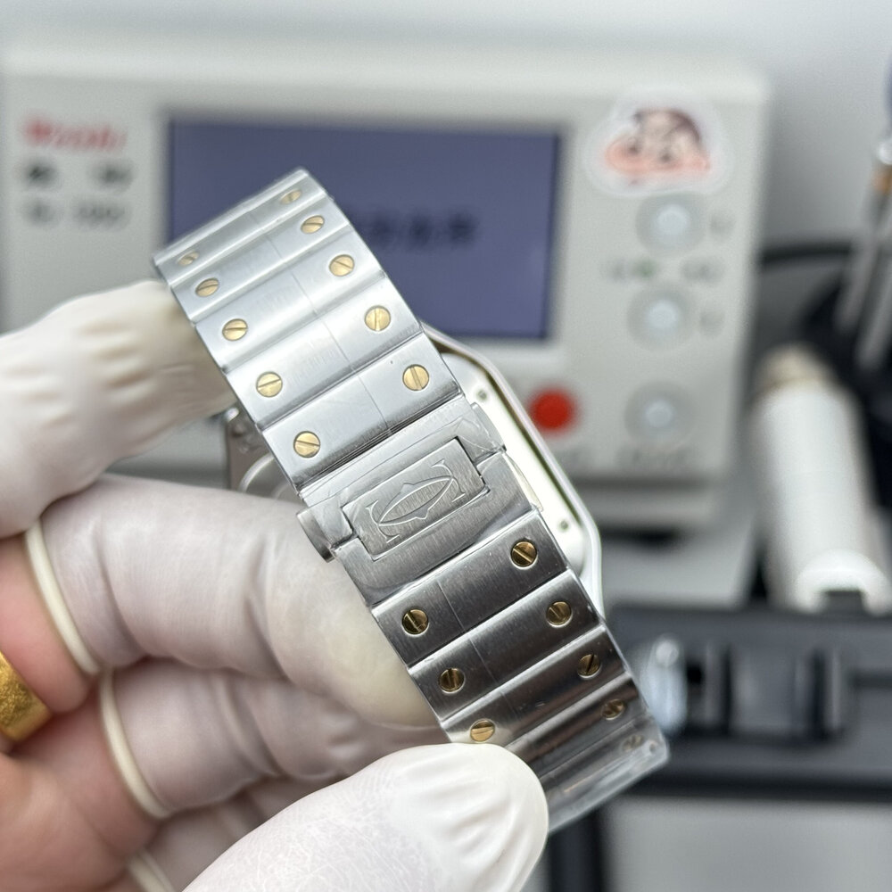 Bracelet centre links pinned by gold-coloured screws down the middle row