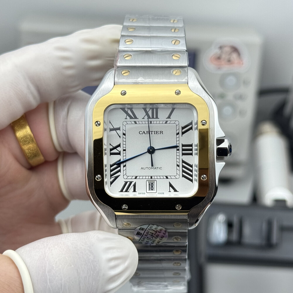 Gold bezel and black Roman numerals fill the frame in this close front view
