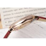 Cardinal hours of the 33mm dial carry printed Roman numerals