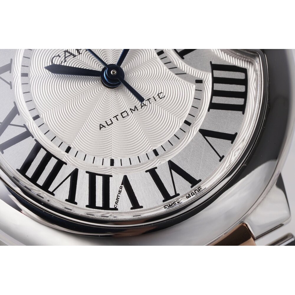 A date aperture at 3 o'clock, half behind the crown guard, with no magnification lens