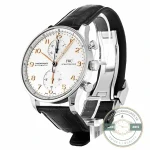 Polished rhodium-plated hands sweep across the black Portugieser chronograph dial