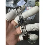 Integrated stainless steel bracelet with brushed links and polished centre bevels, fold-over clasp