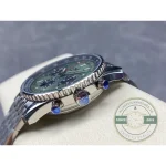 Date window inside the black 6 o'clock counter of the mint green Breitling Navitimer B01