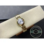 Sword hands of blued steel in warm gold-tone surroundings, 36mm across
