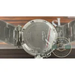 Solid caseback screwed shut, the word automatic engraved around its rim