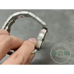 Bracelet curled into a loop, each link brushed on top and polished at the edge