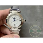 Silvered guilloche dial held up close, date window cut between four and five