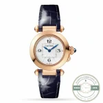 The same rose gold Pasha on a navy alligator strap, blue cabochon at the cap