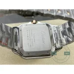 Brushed steel caseback among the set links, serial lines engraved across it