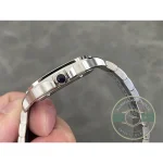 Blue cabochon crown on the polished flank of the skeletonised steel case
