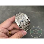 Whole skeleton watch cradled in the palm, bracelet coiled beneath the case