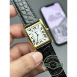 Held front on with Roman numerals ranged down both sides of the dial