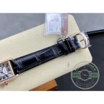 Paper tag still looped through the strap where the buckle closes