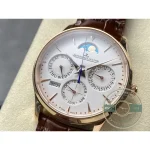 Applied gold baton markers and the blued central seconds hand on the white calendar dial