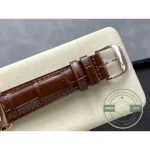 Angled view of the pink gold case and white perpetual calendar dial in direct light