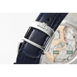 Steel pin buckle fastened over the blue alligator, JL monogram on the frame