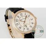 Dial at an angle: rose gold leaf hands, black floral numerals, gold minute dots