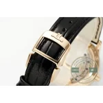Pink gold pin buckle engraved with the JL monogram, closed over black alligator
