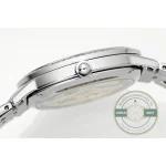 Side of the case with the pushed-in crown and the flat steel bracelet end link