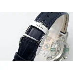 Steel pin buckle closed over blue alligator, JL monogram cut into the frame