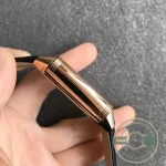Lug area where the black alligator strap meets the rose gold case of the Reverso replica