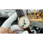 39mm rose gold JLC Master Ultra Thin Moon 39 clone worn on the wrist below a shirt cuff