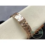 Rose gold tone crown and polished case ears of the silver-dial Nautilus 5740-style