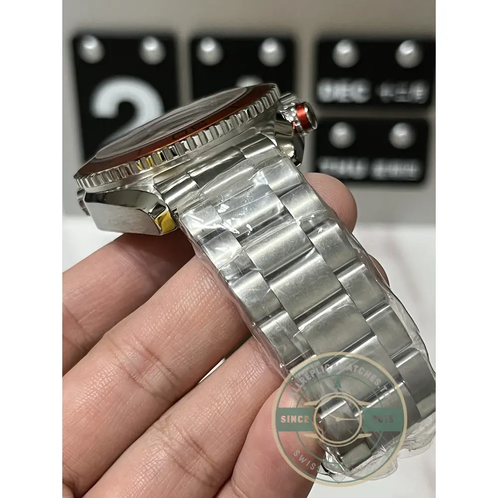 Liquid-metal diving scale set into the bezel of the clone Omega Seamaster 600M chronograph