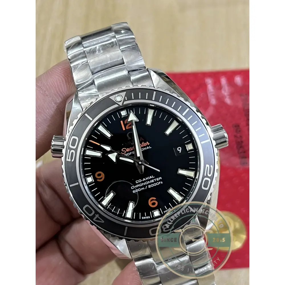 Low off-wrist profile of the super clone Omega Planet Ocean, 42mm steel under a shirt cuff