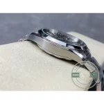 Rhodium-plated applied hour markers cutting against the olive dial of the Aqua Terra superclone