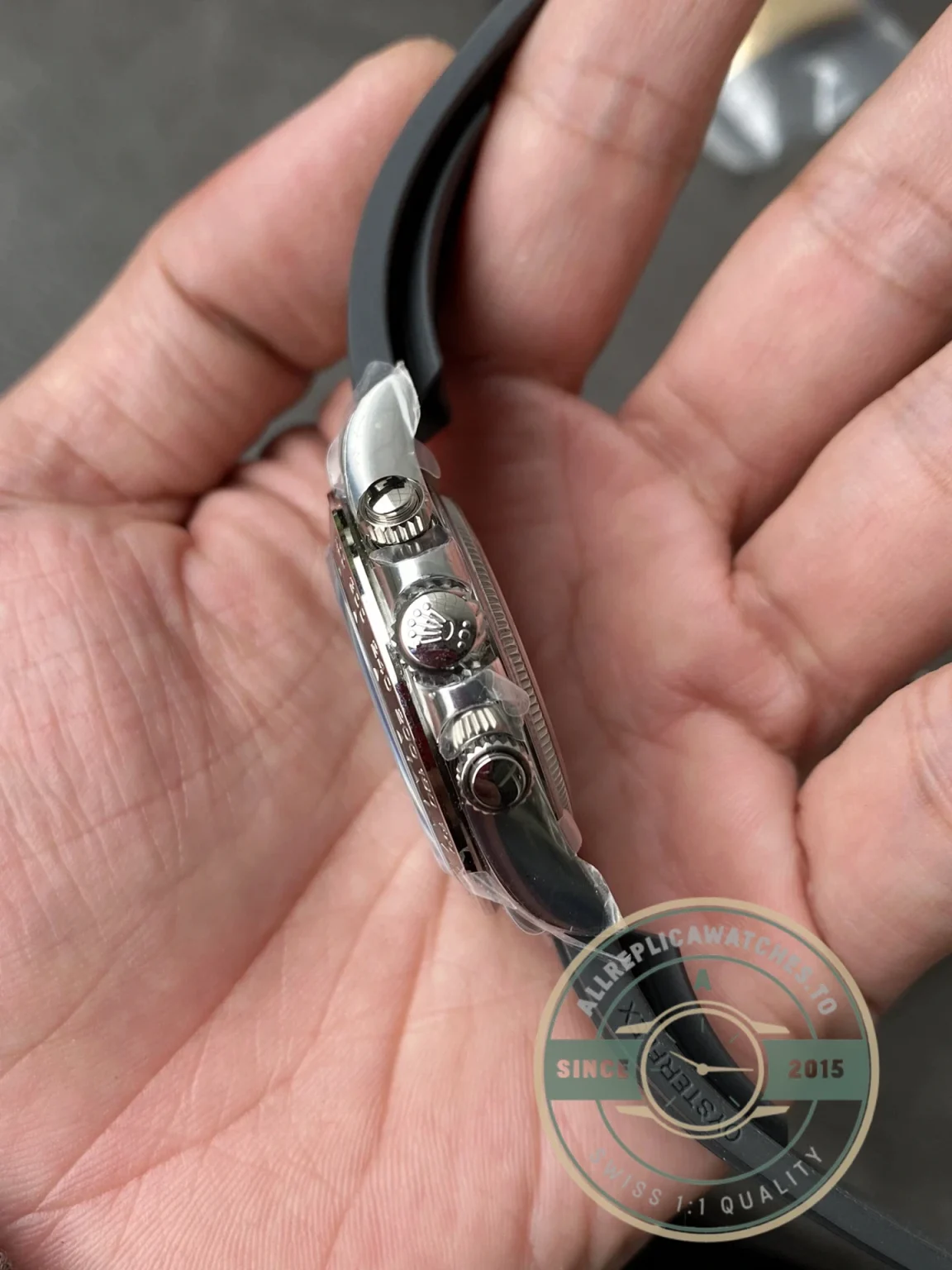 Crown and pusher detail on the Daytona 126519LN showing Triplock screw-down system