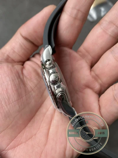 Crown and pusher detail on the Daytona 126519LN showing Triplock screw-down system