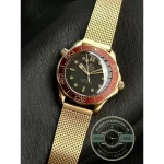 Domed sapphire crystal, anti-reflective on both faces, over the titanium Omega superclone dive dial