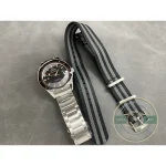 Applied luminous indices spaced around the black dial, clone Omega Seamaster 300 in steel