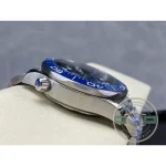 Royal blue in direct light, near-black in shadow across this Omega Seamaster chronograph replica