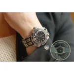 Laser-ablated markings on the black ceramic dial of this 007 Seamaster clone