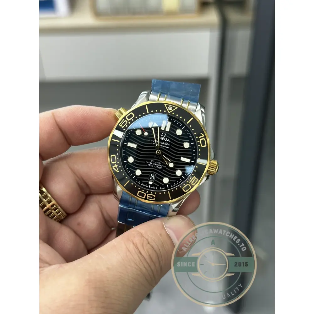 Dark wave-pattern dial of the superclone Omega Seamaster Diver 300M with gold-tone indices