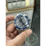 Grey dial reading silver indoors and charcoal under sun, steel Seamaster super clone