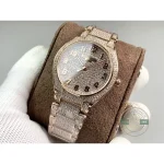 Rose gold-tone hands over the stone-covered dial of the fully paved Twenty~4 7300/1450R-001