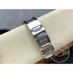 Clasp hidden on the steel bracelet closes with no hardware in sight