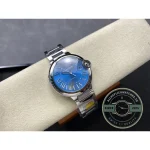 Cabochon on the crown echoes the dial, a second note in the same colour