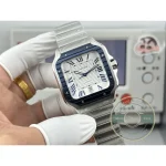 Close front frame: blued hands crossing a silvered dial inside a blue ring