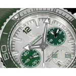 Replica Omega Planet Ocean chronograph worn on the wrist, green dial and date aperture in view