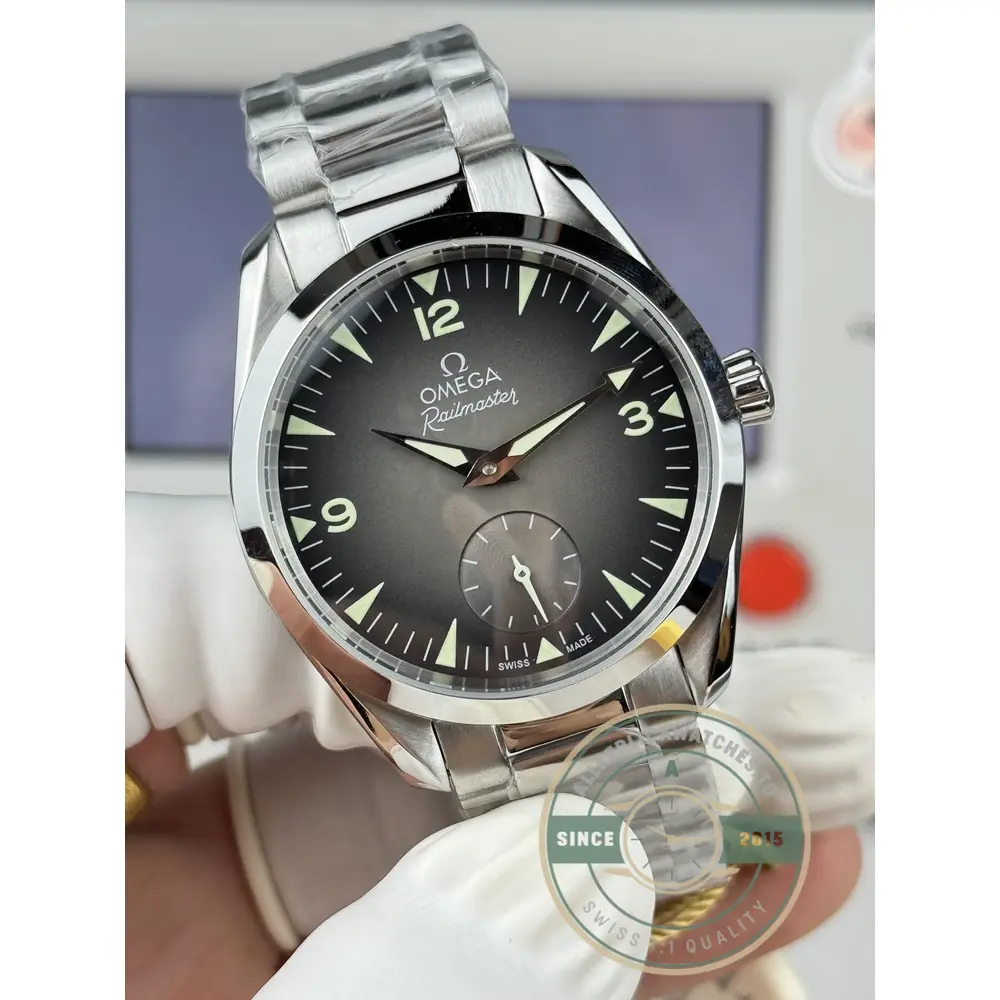Clone Omega Railmaster broad arrow handset reaching across the brushed grey dial