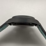 Matte titanium hiding fingerprints and micro-abrasions a polished case would show