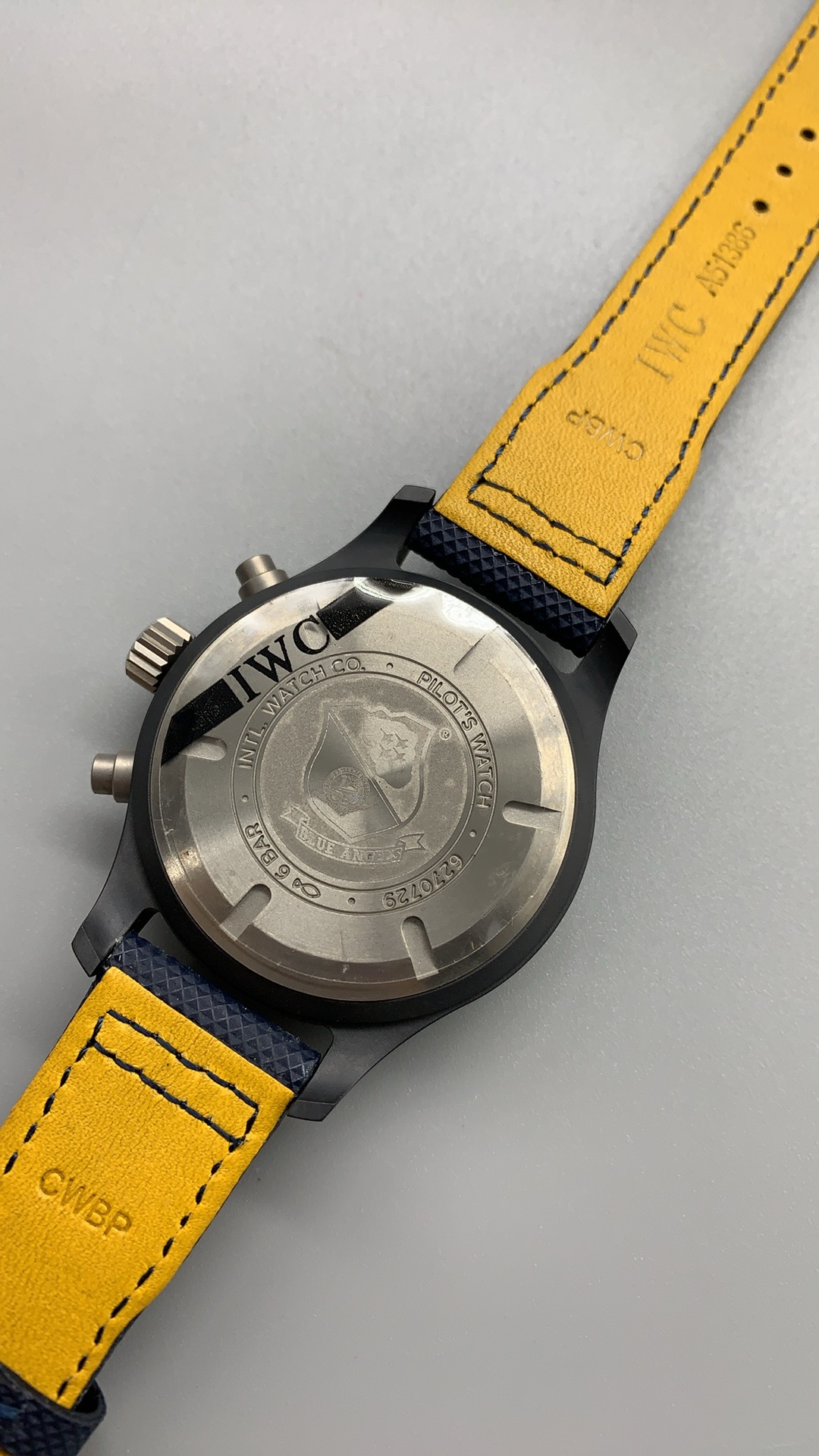 Minute-track and seconds-hand accents in yellow where others use white