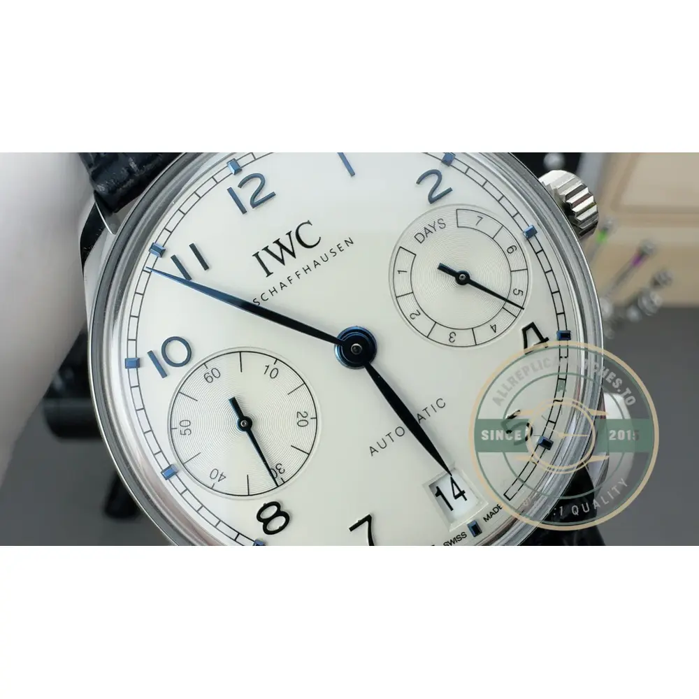 Against the silver dial, a blue alligator strap on a steel folding clasp